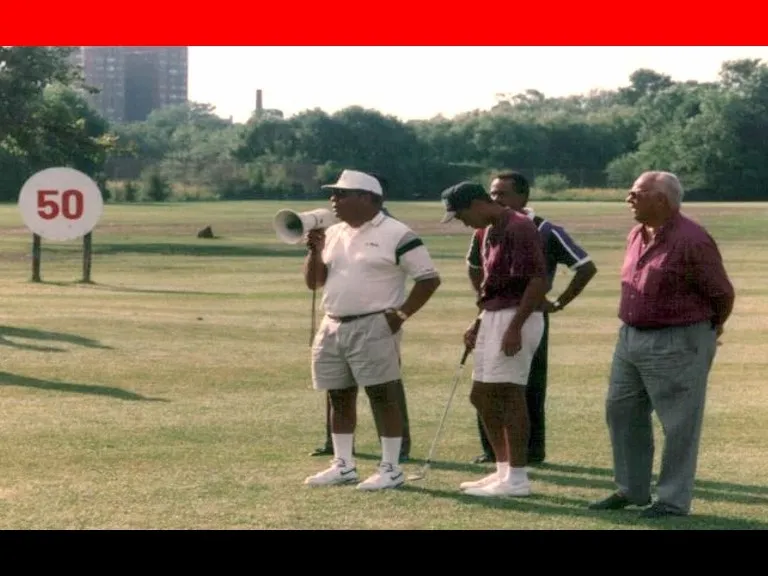 Tiger's dad, Earl Woods, welcomes attendees to the golf clinic